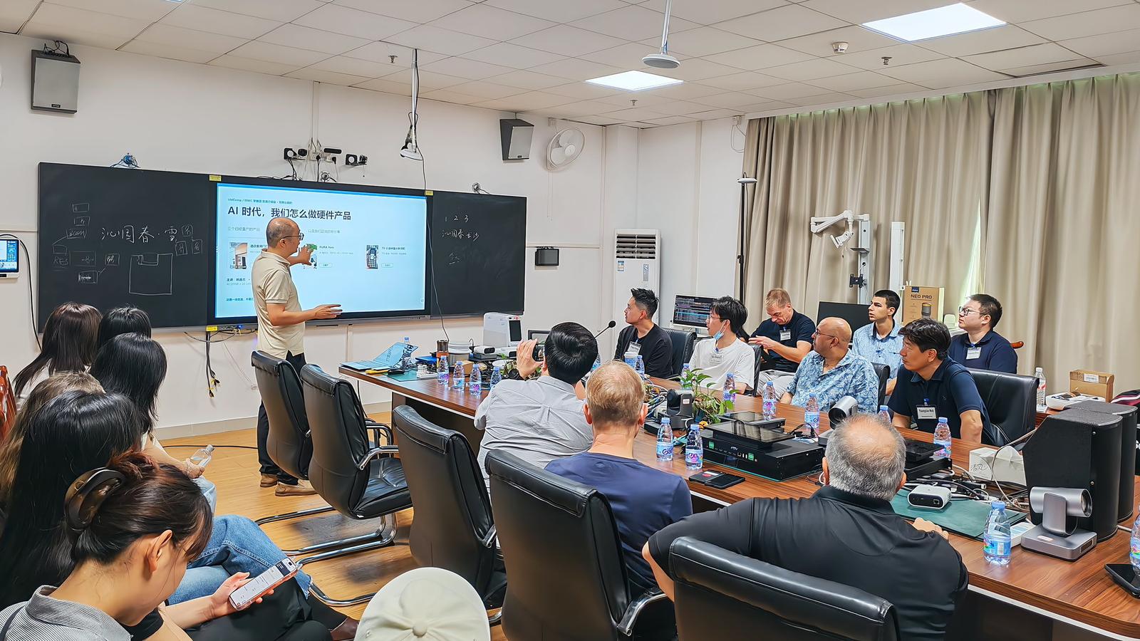 Tom Yao of MeToclaw giving the talk 'How We Build Hardware Products in the AI Era' to the visiting UbiComp/ISWC delegation